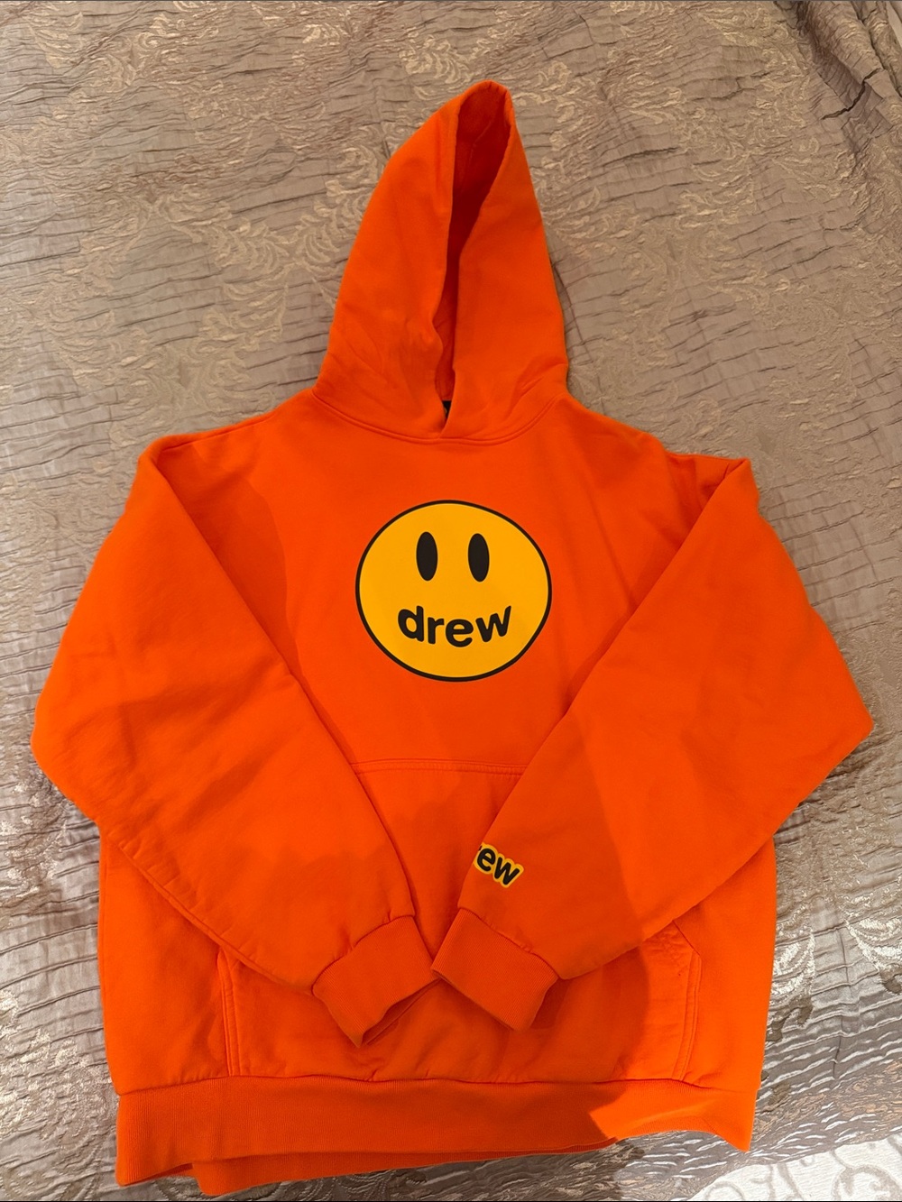 drew house orange hoodie with yellow smiley